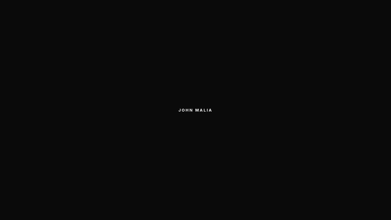 Screenshot of Johnmalia.com